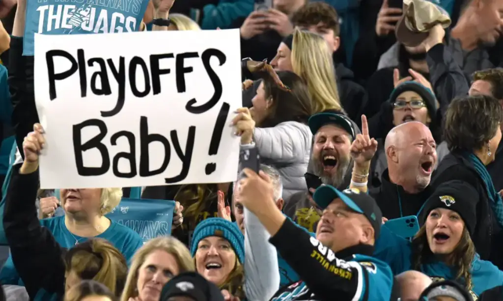 Eagles Fans with a Playoffs Banner at their Week 18 game