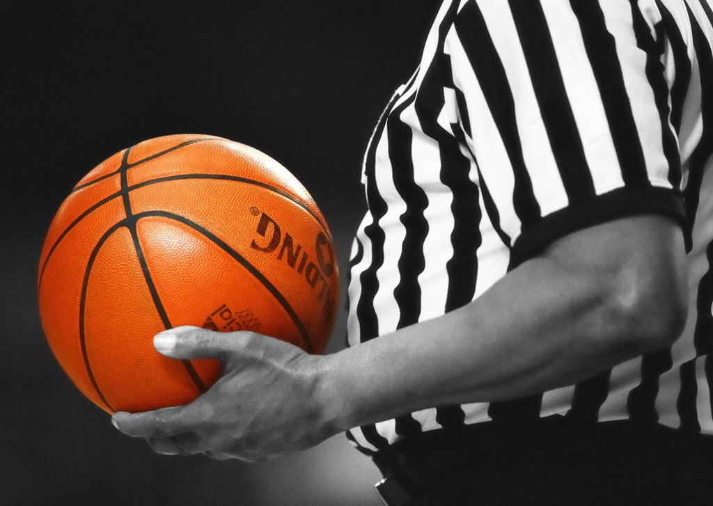 Ref holding a basketball