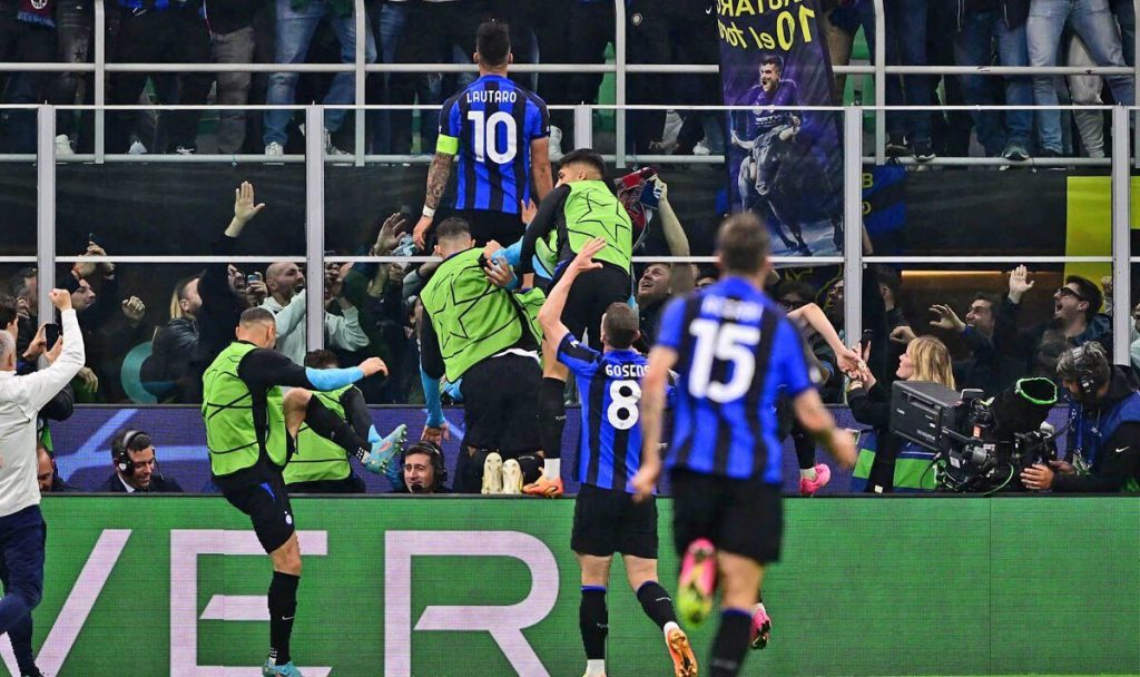 Inter Milan players celebrating with fans after confirming their place in the 2023 Champions League final