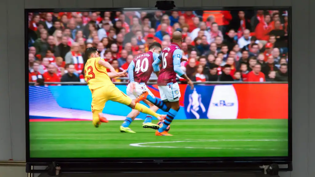 Football match between Liverpool and Aston Villa on TV