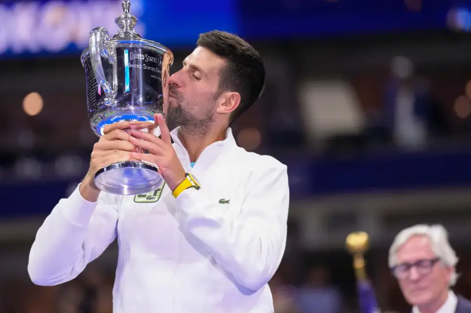 Novak Djokovic, one of the world's greatest athletes, lifting his 24th Grand Slam title