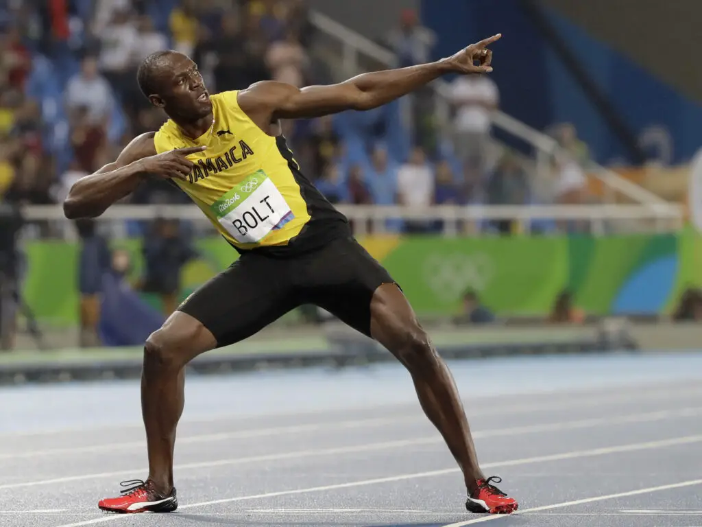 Usain Bolt from Jamaica celebrates winning the gold medal in the men's 200-meter final during the athletics competitions of the 2016 Summer Olympics at the Olympic stadium in Rio de Janeiro, Brazil.