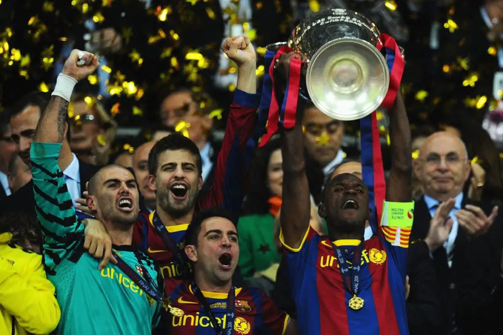 Eric Abidal lifting a trophy after his recovery from cancer