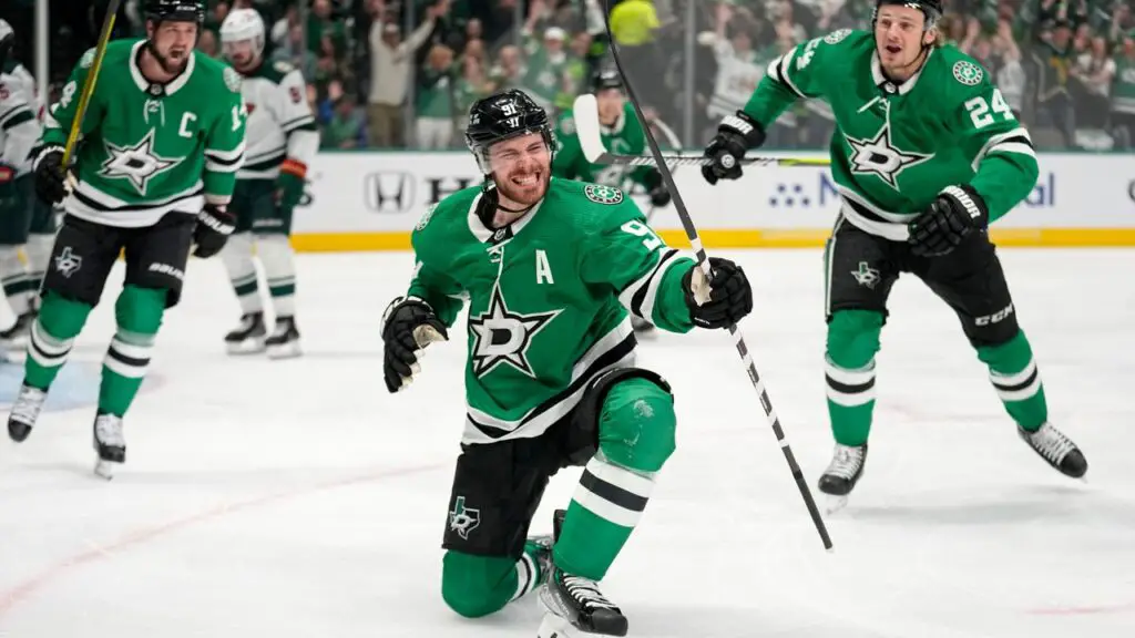 Dallas Stars celebrating in their NHL game after scoring against the Minnesota Wild