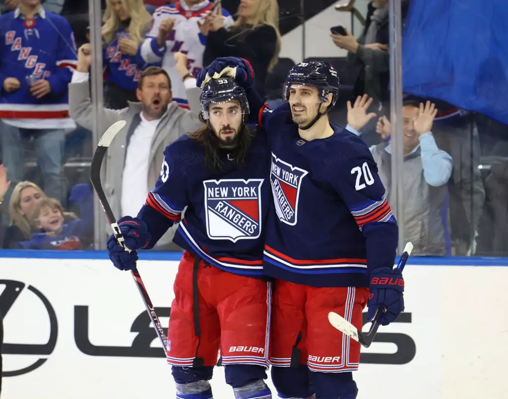 Mika Zibanejad #93 of the New York Rangers celebrates with Chris Kreider #20 of the New York Rangers after Zibanejad scores a goal during the third period when the New York Rangers defeated the Anaheim Ducks 5-1 Friday, December 15, 2023 at Madison Square Garden in Manhattan, NY.