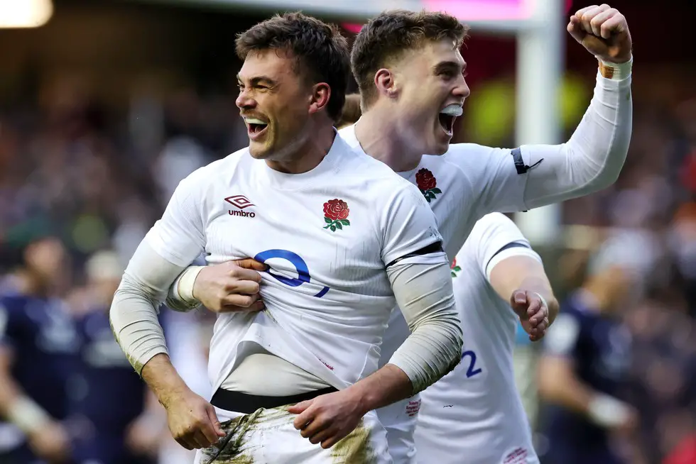 George Furbank of England celebrates scoring his team's first try with teammate Tommy Freeman during the Guinness Six Nations 2024 match between Scotland and England
